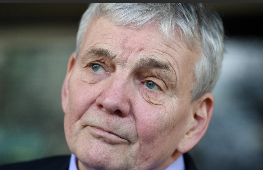 Head-and-shoulders portrait of Dr Robert Moles, grey-haired, looking off to one side.