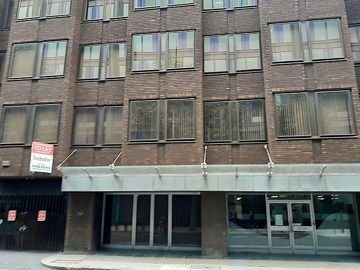 Brick office block with a glass-fronted ground floor and a metal canopy over the entrance, a "To Let" sign on the facade: Lion House on Red Lion Street, London, home of the APPEAL charity.