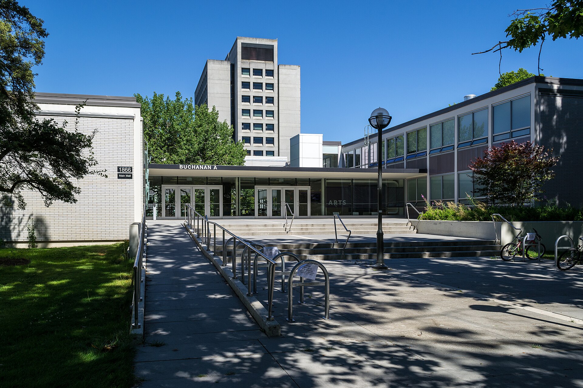 The entrance to the Buchanan Building at the University of British Columbia, with Buchanan Tower behind it.