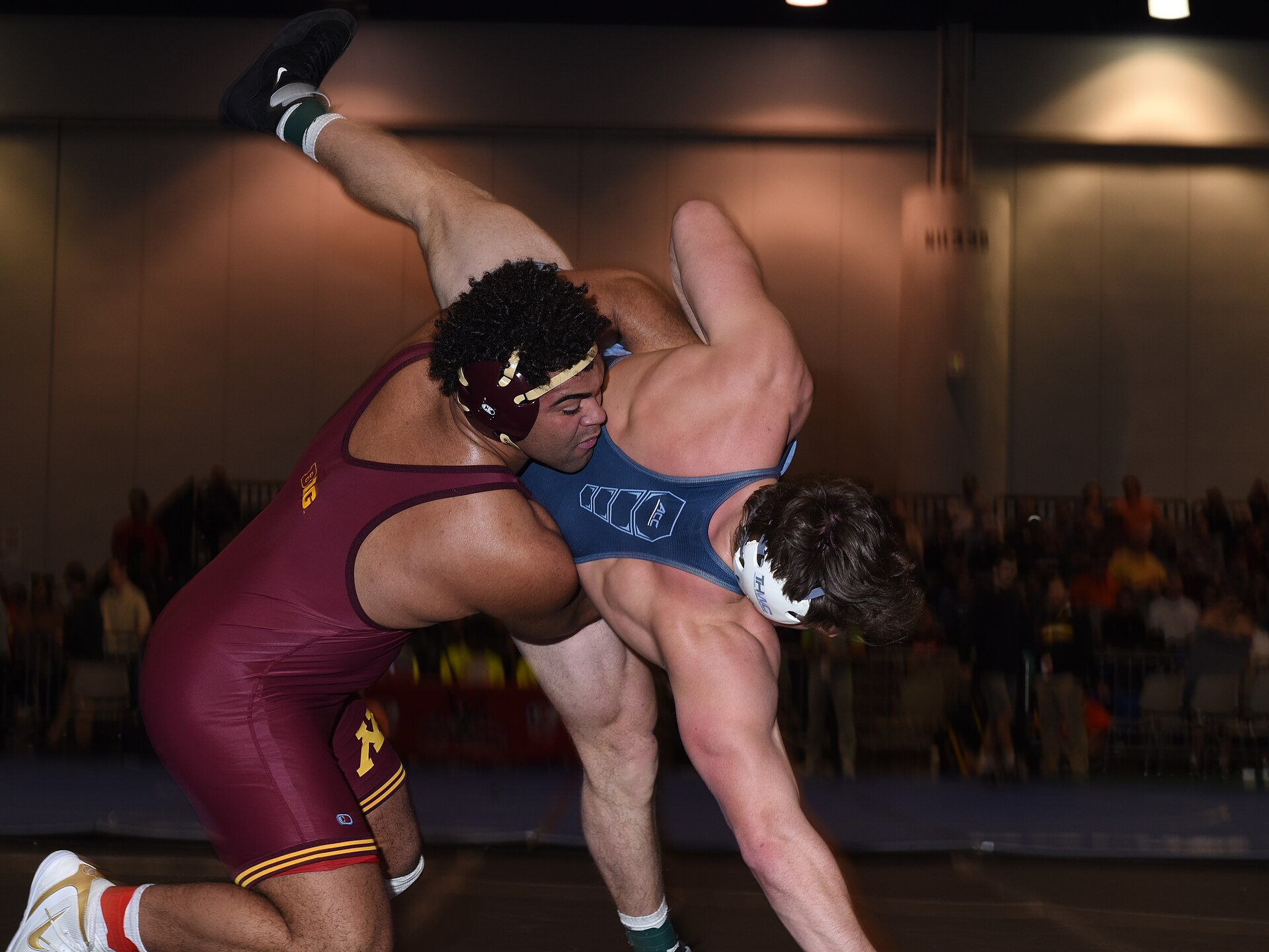 Gable Steveson, in a Minnesota singlet, wrestling Cory Daniel of North Carolina in December 2018
