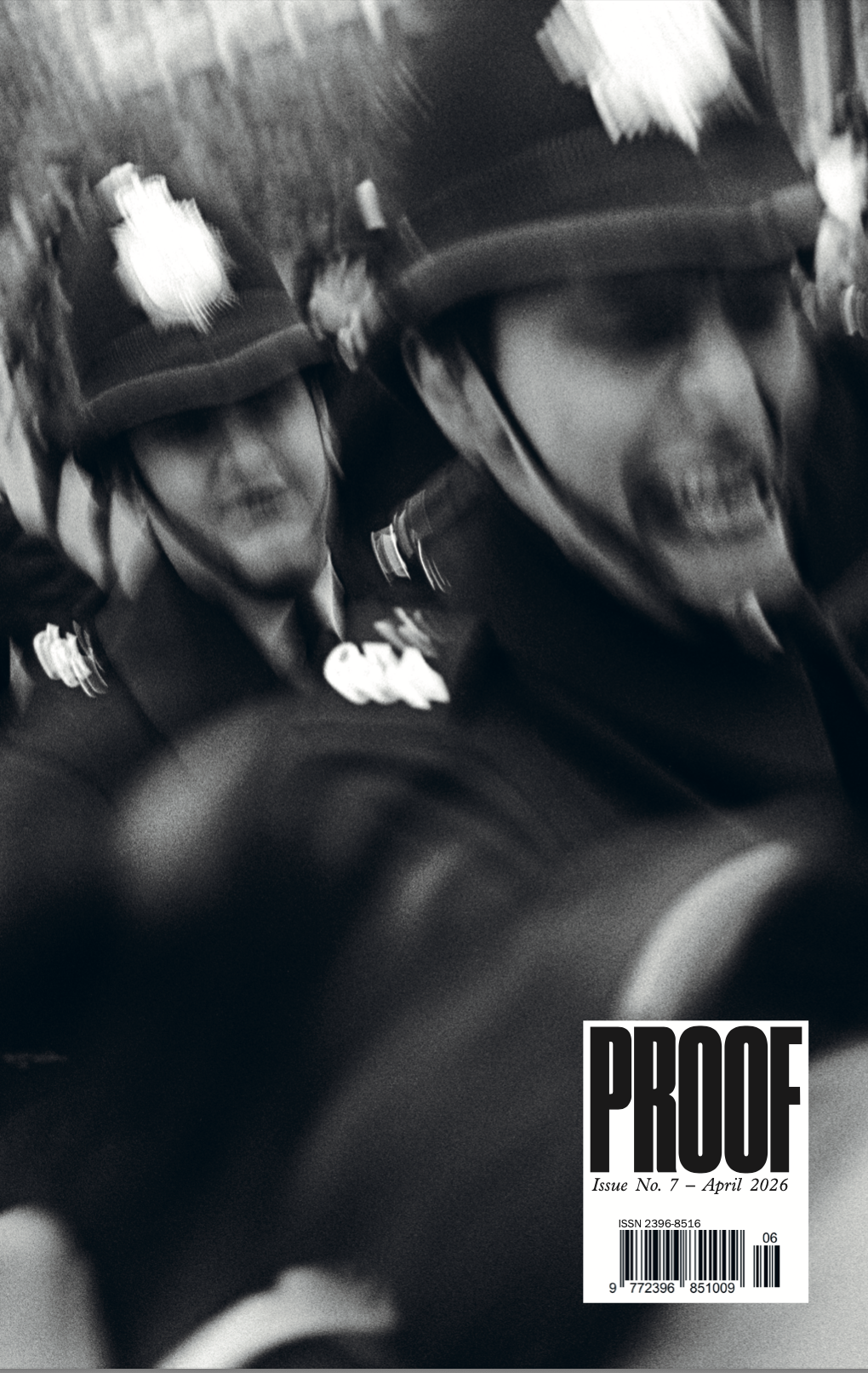 Cover of PROOF magazine issue No. 7, April 2026: a blurred black-and-white photograph of police officers in custodian helmets.